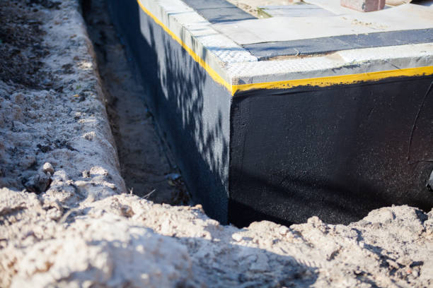 Professional Waterproofing technician working in Brookville, NY